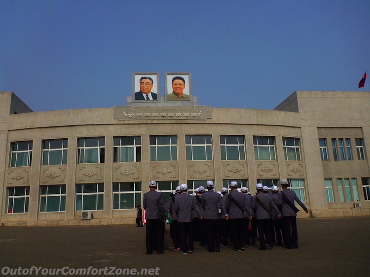 North Korea Pyongyang Kim il-Sung and Kim Jong-il portrait workers marching