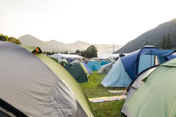 A campground with a lot of tents.